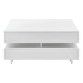 Table basse moderne blanche avec rangement intégré.